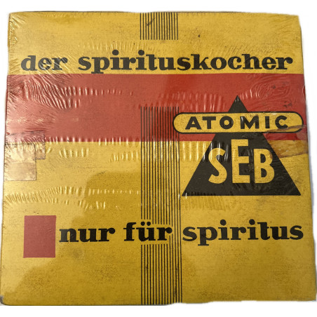 Le réchaud ATOMIC SEB à gaz d'alcool en fer blanc encore sous platique